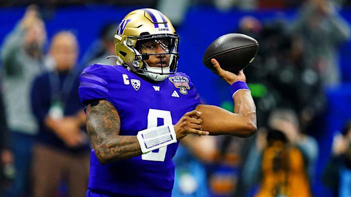 Washington Huskies quarterback Michael Penix Jr. throws the football against the Texas Longhorns in the Sugar Bowl.